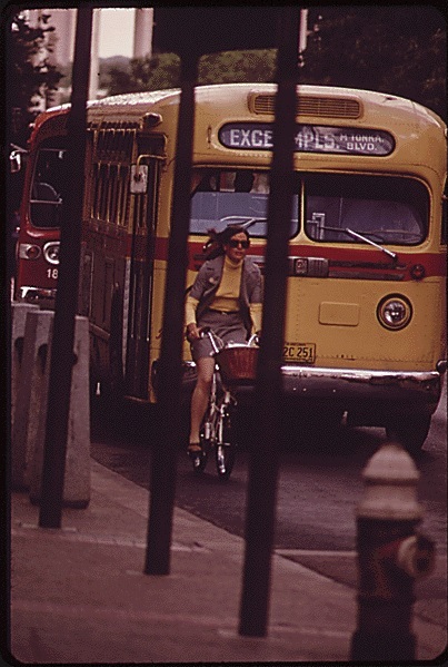 documerica photo of nicollet mall, woman on bike plus bus